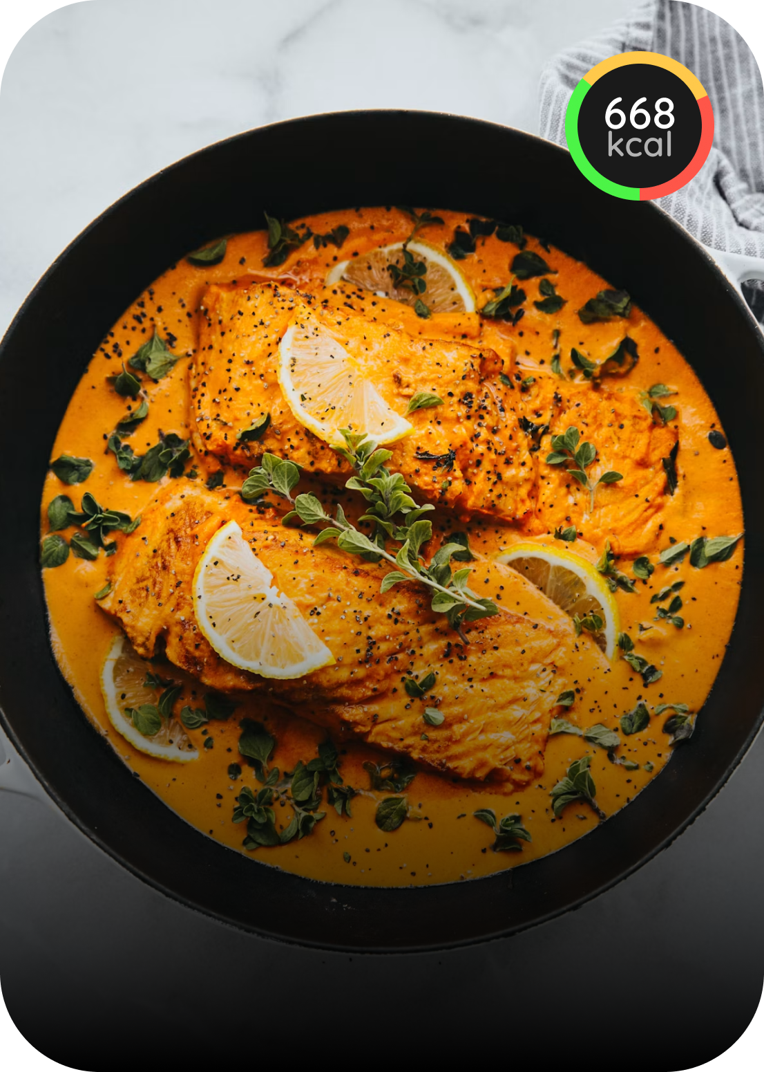 Salmon fillets with lemon and herbs in a creamy sauce