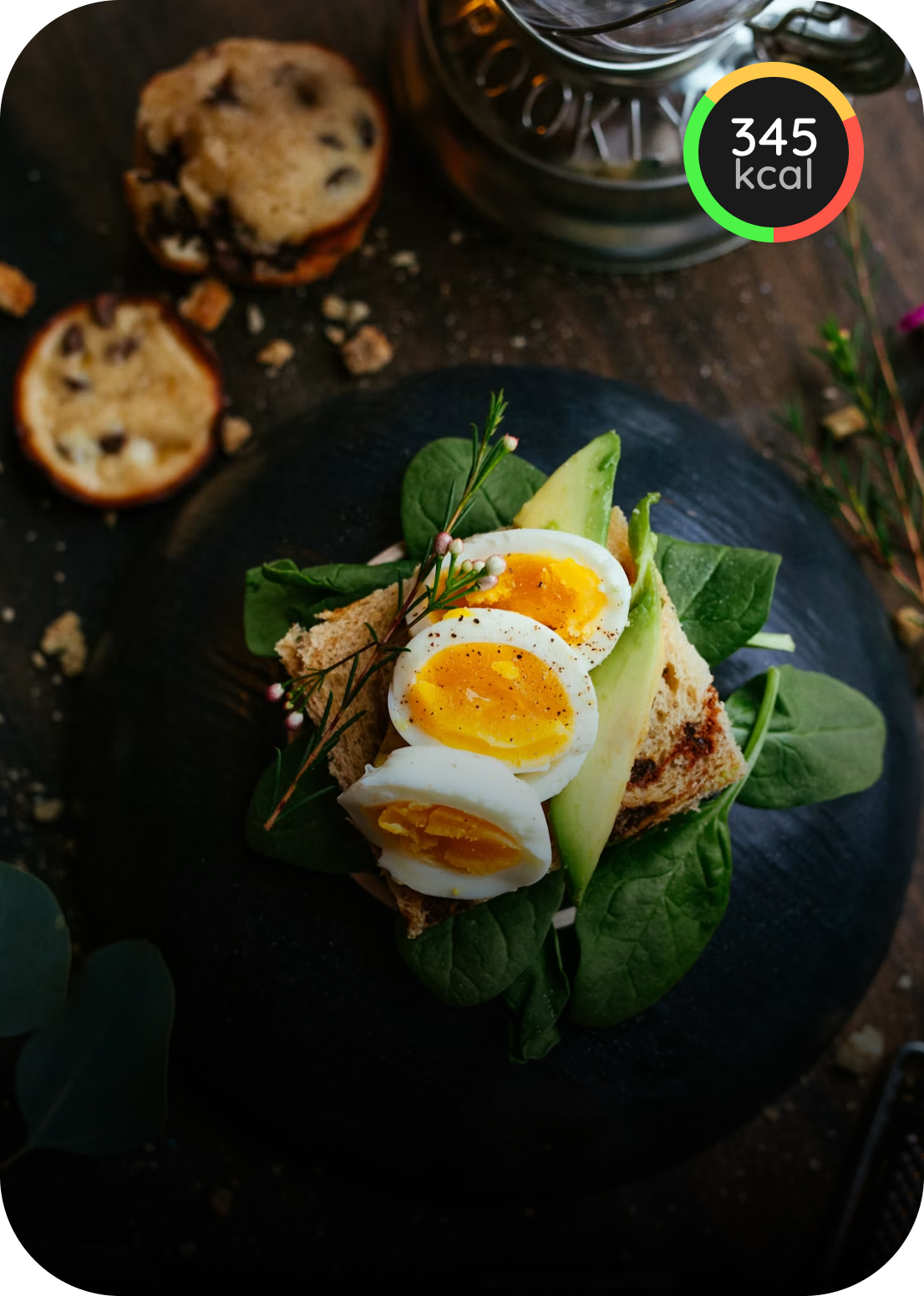 Toast topped with avocado, spinach, and sliced eggs